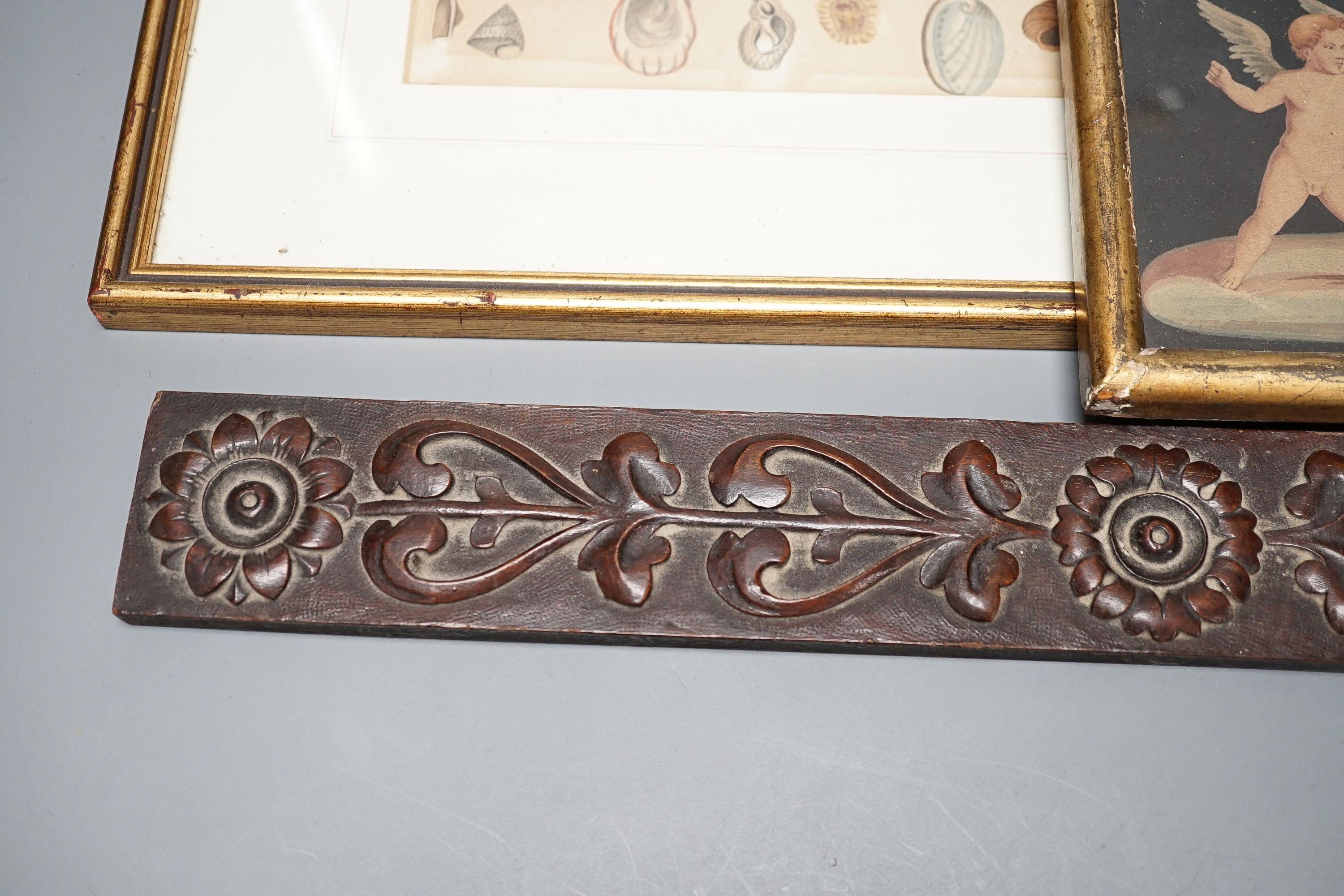 A pair of Aesthetic period relief carved mahogany panels with stylised floral designs, 43 x 5cm, a neo-classical print of cherubs, 14 x 24cm and a small hand coloured print of shells